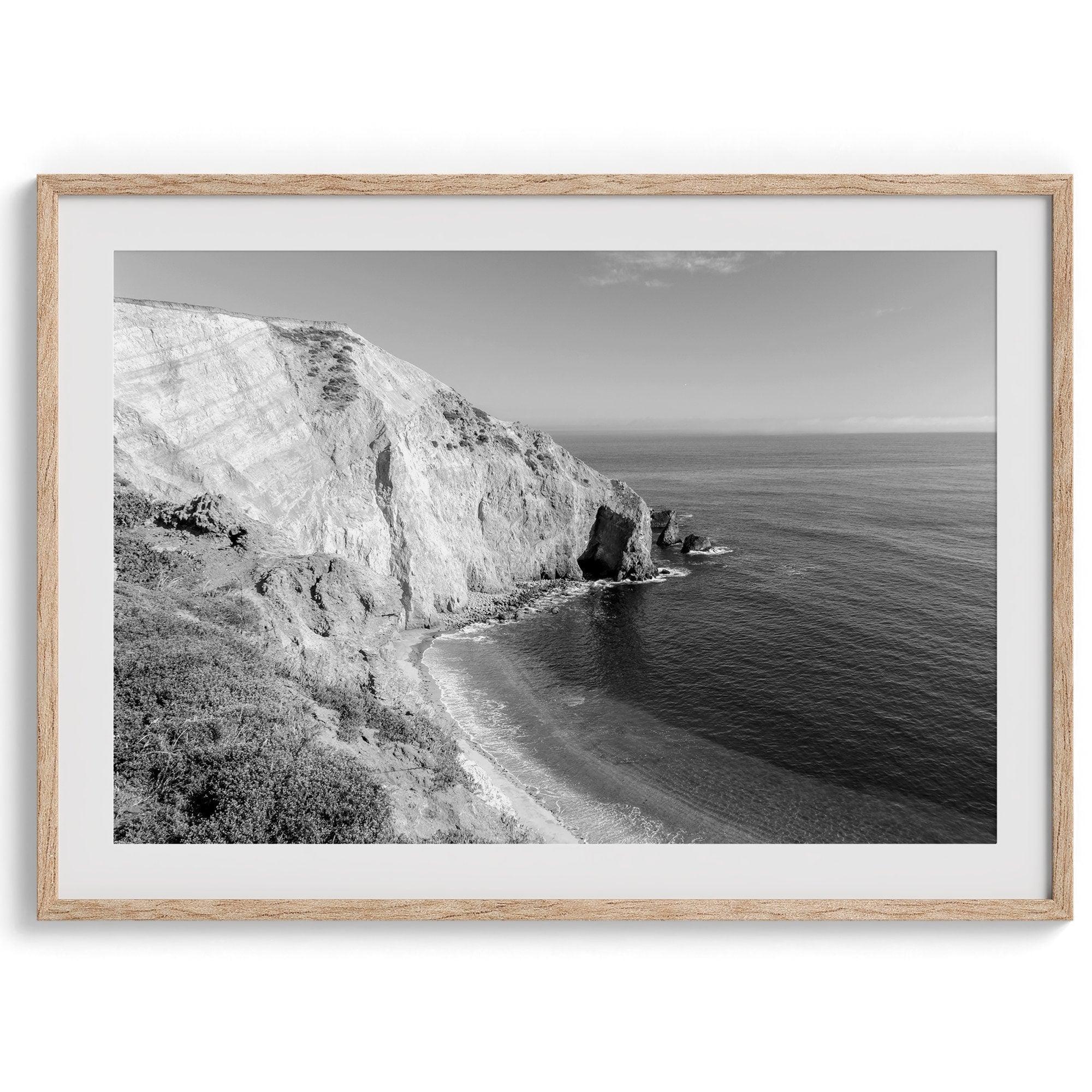 A black and white fine art ocean wall art print of a coastal cliff and beautiful beach in Chimney Rock trail, Point Reyes, California.