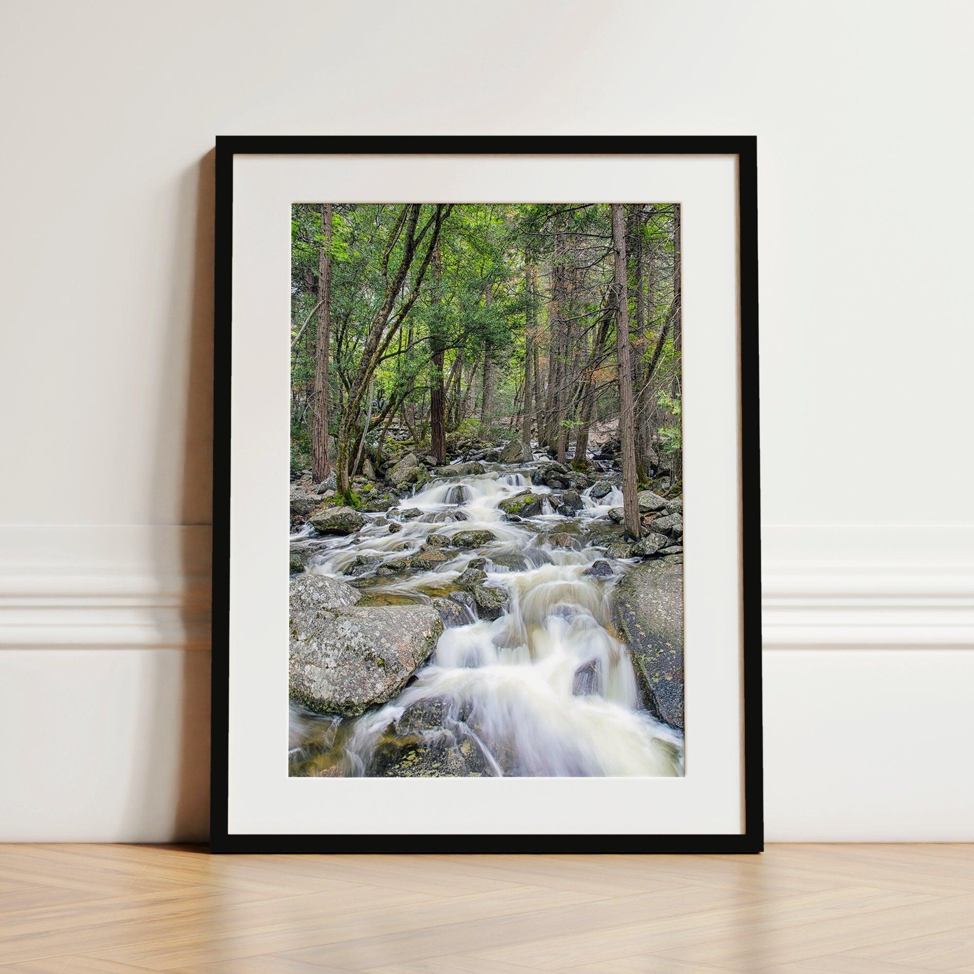 A beautiful river cuts through the forest, shot in long exposure making the water look creamy and calm in this fine art Yosemite National Park print.