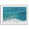 A fine art ocean print of an aerial beach showing a lone surfer with a large wave underneath.