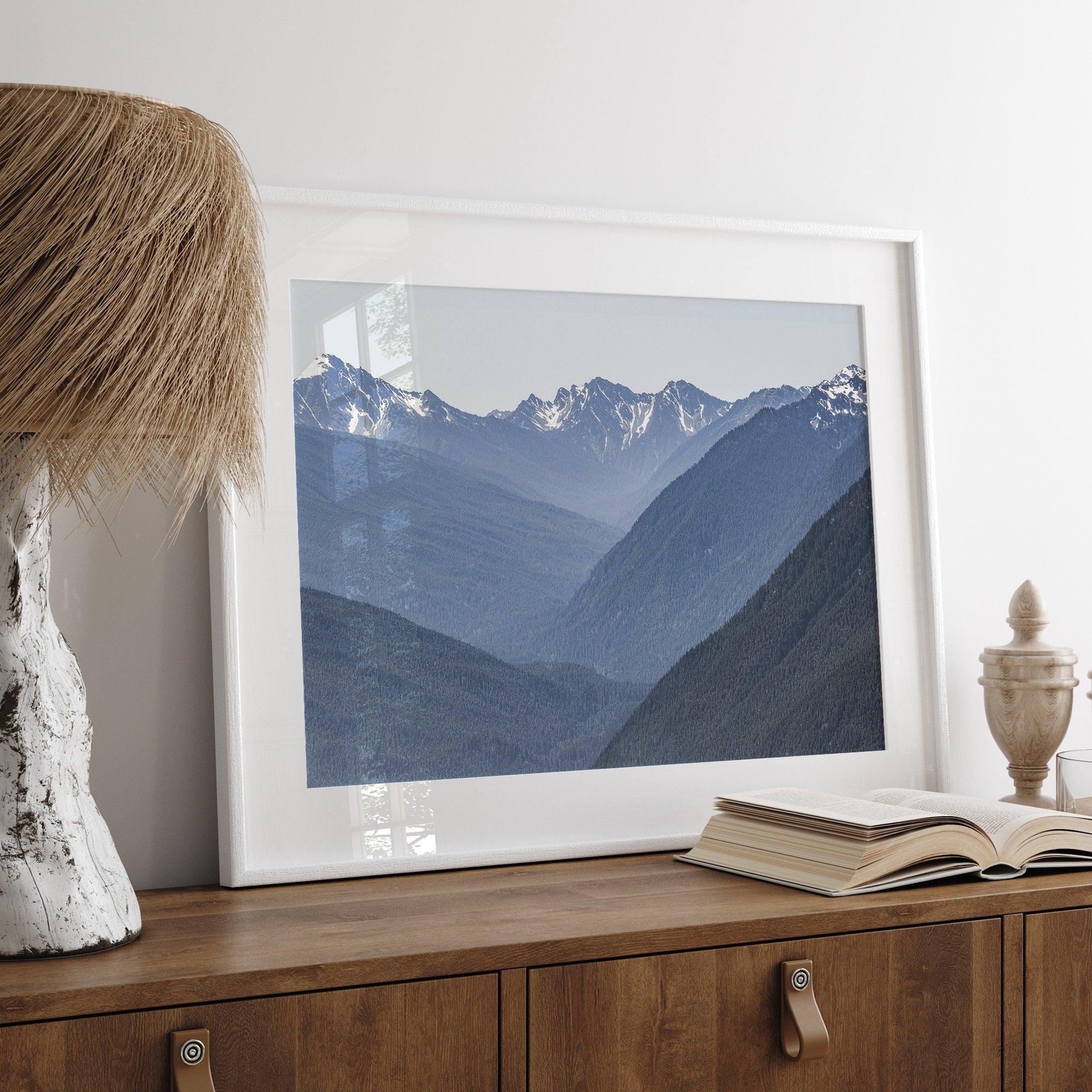 A fine art mountain range print. This mountain wall art showcases the layered misty blue mountains of Olympic National Park in Washington.