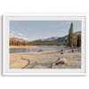 A framed lake print capturing the unique landscape of Horseshoe Lake in the Mammoth Lakes area. This Pacific Northwest wall art showcases the barren ground around the lake and the lush forests and majestic mountains of the Eastern Sierra region.