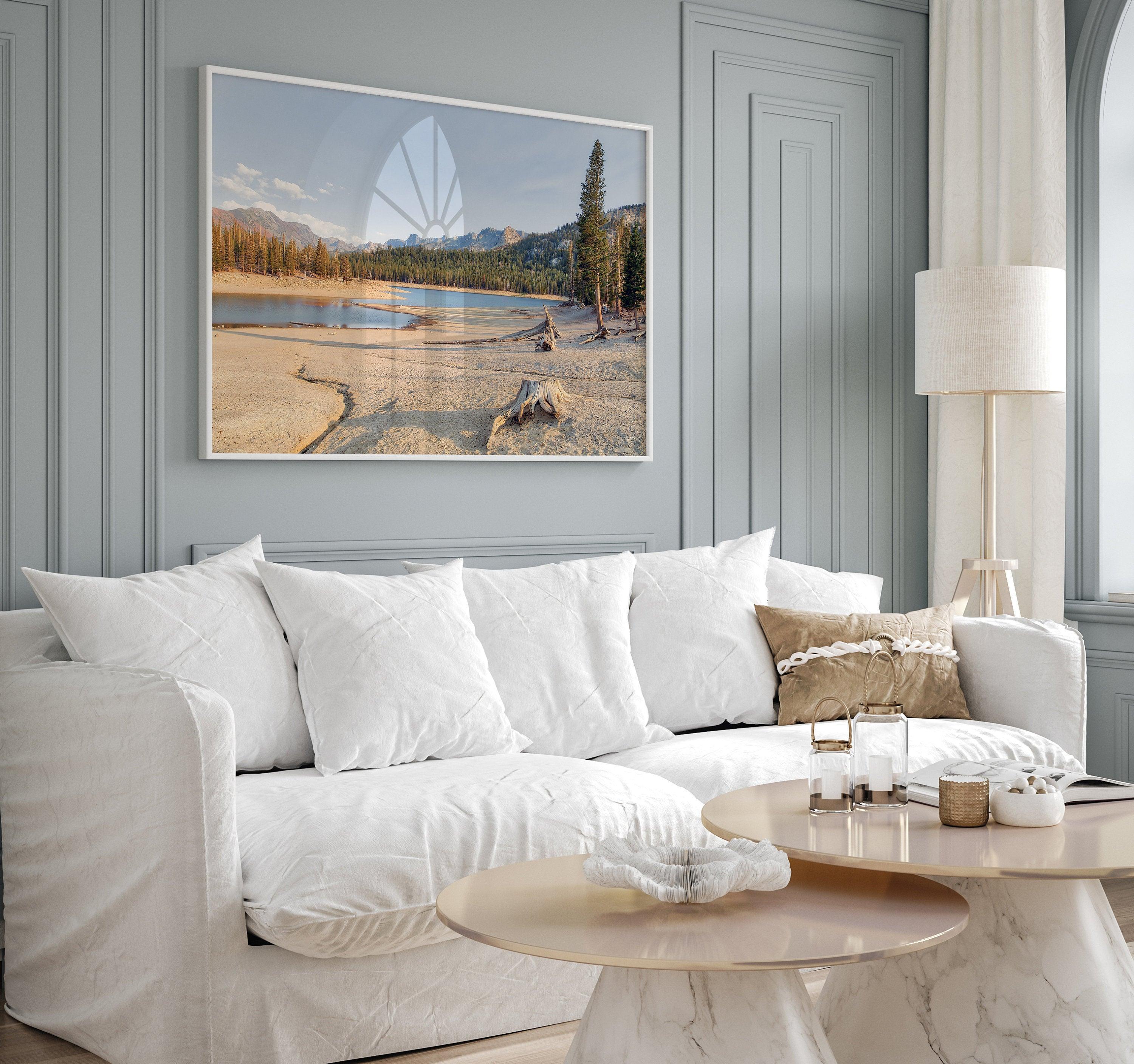 A framed lake print capturing the unique landscape of Horseshoe Lake in the Mammoth Lakes area. This Pacific Northwest wall art showcases the barren ground around the lake and the lush forests and majestic mountains of the Eastern Sierra region.