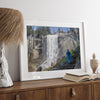 Climb the breathtaking Mist Trail in Yosemite National Part with this fine art waterfall nature print. This nature landscape wall art showcases the stunning gushing waterfall and the people scaling the trail with their colorful raincoats.