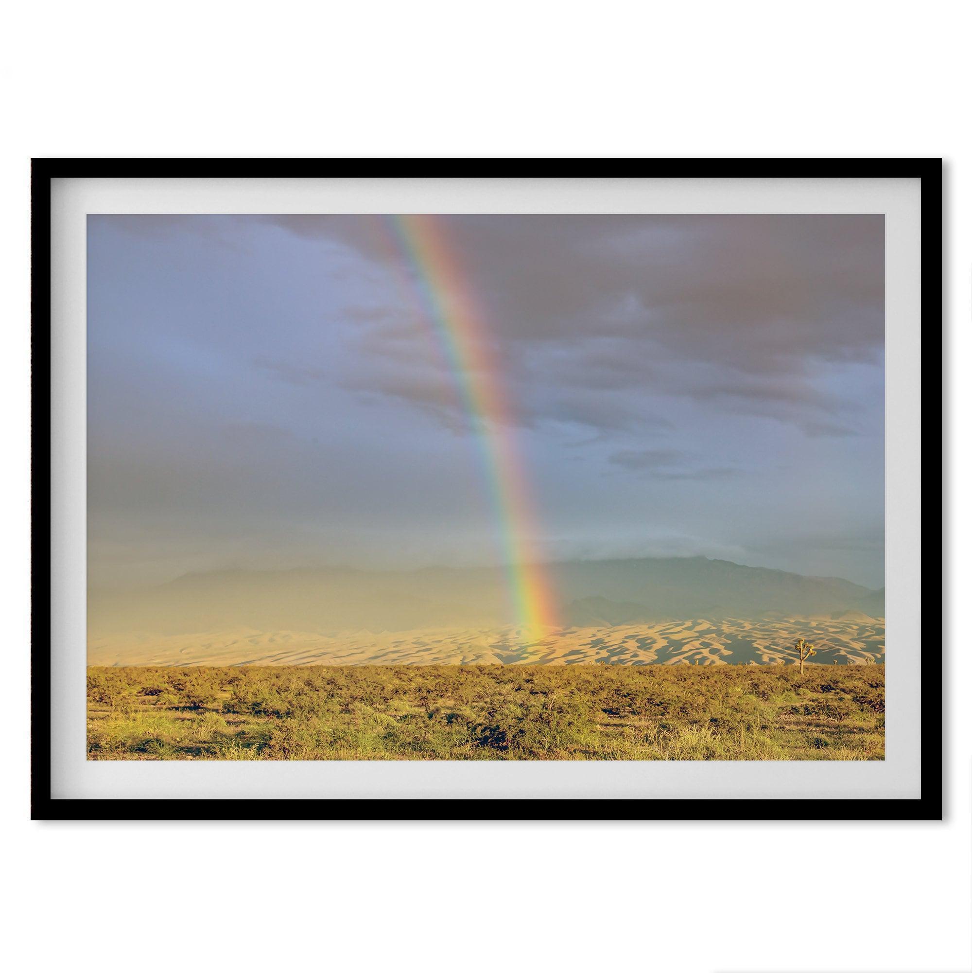 A fine art unframed or framed Arizona desert print showcasing a beautiful rainbow and cloudy sky in the middle of the desert landscape.