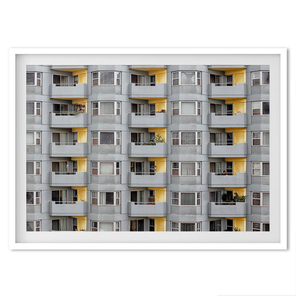 A fine art San Francisco minimalist architecture print of a unique modern building with colorful yellow balconies.