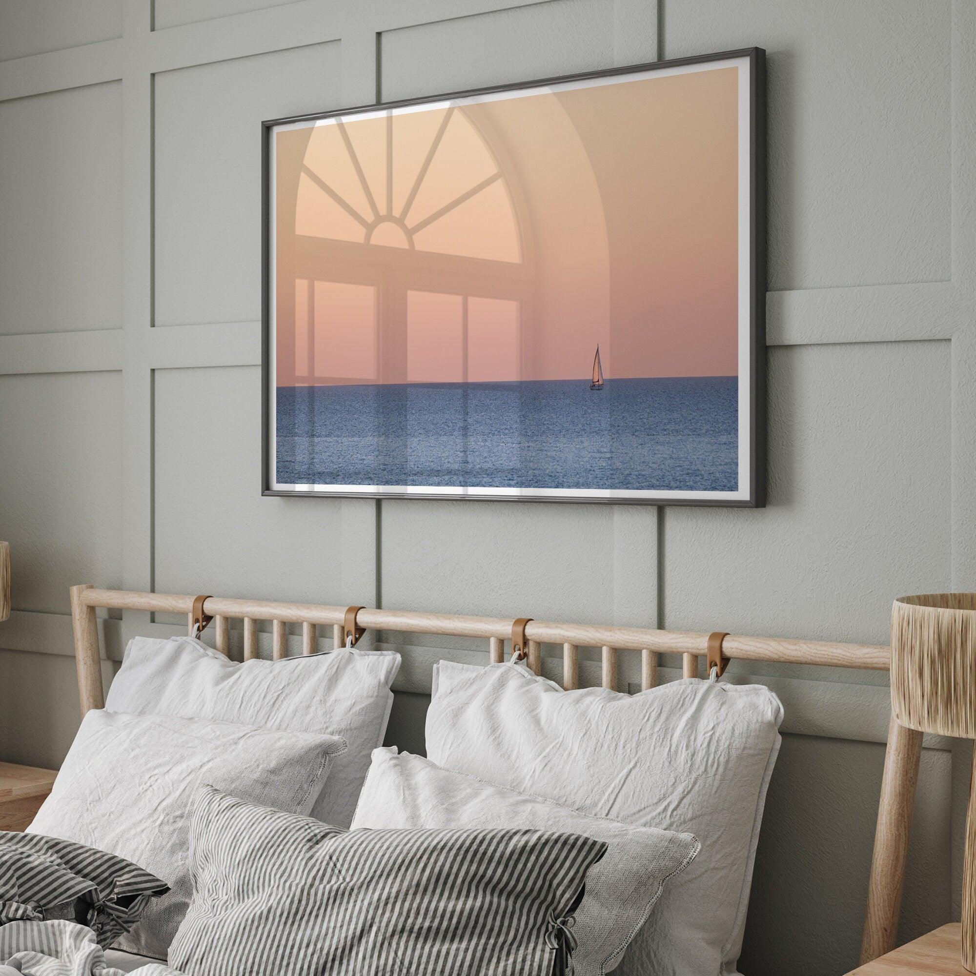 This stunning fine art ocean sunset photography print features a breathtaking scene of a boat against a golden and pink sky at sunset. The warm glow of the sunset and the natural beauty of the ocean and sky combine to create a soothing atmosphere.