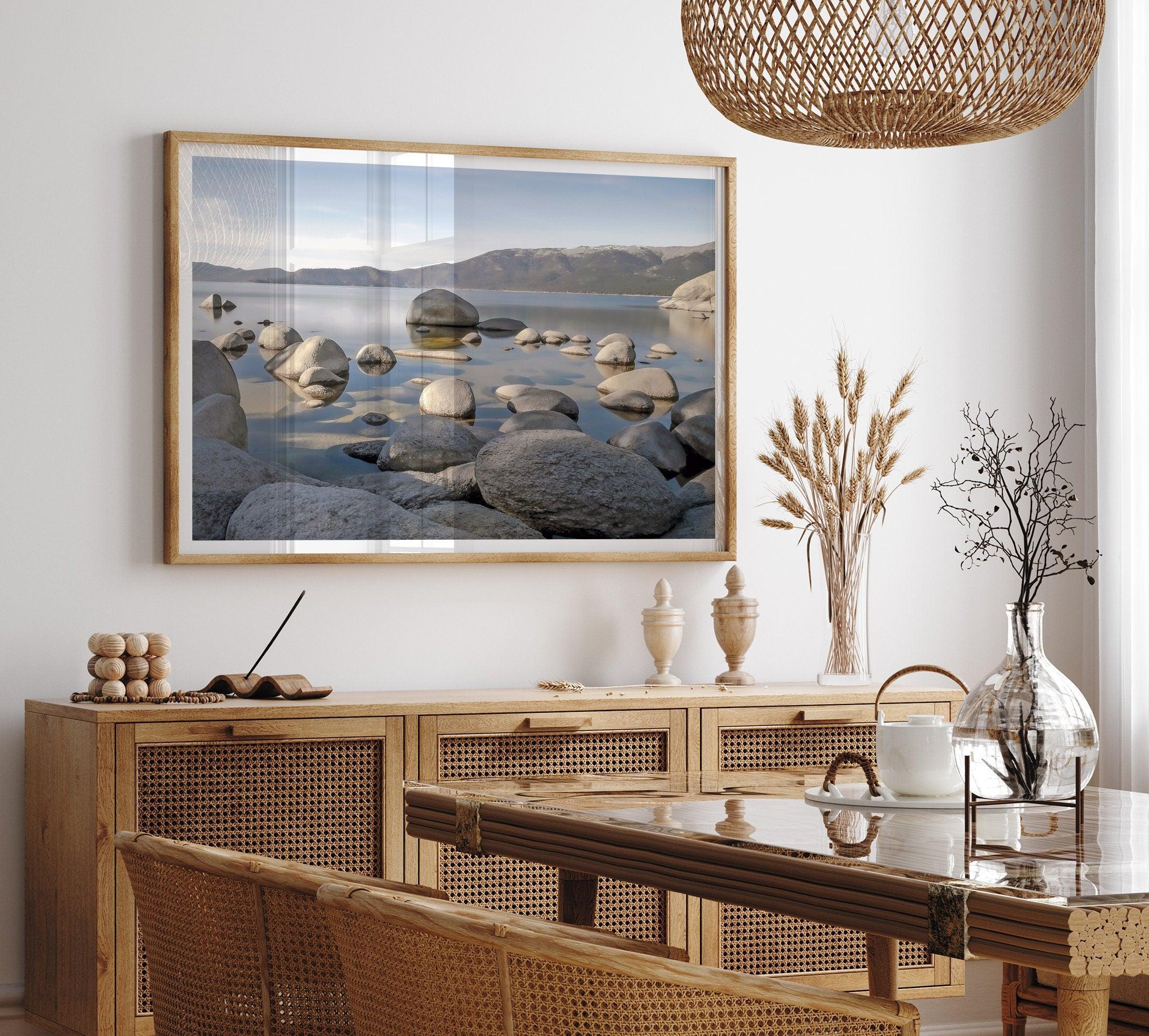 This breathtaking fine art Lake Tahoe print captures the perfect shape of the huge rocks that rise from the crystal-clear water, creating a beautiful contrast against the blue sky and the distant mountain range.