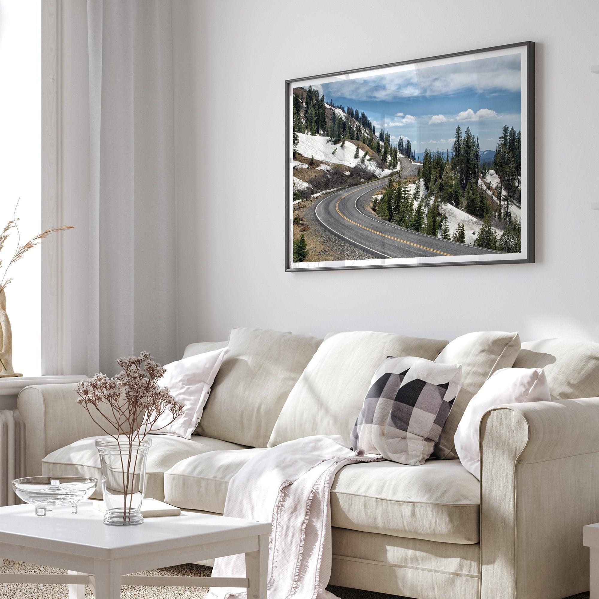 An unframed or framed fine art print of a mountain in Lassen National Park, Featuring a winding road through the lush forest and snow covered mountain.