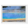 A fine art colorful photography print of Grand Prismatic Hot Springs in Yellowstone National Park. The picture shows the scale of the hot springs next to the people walking next to it.