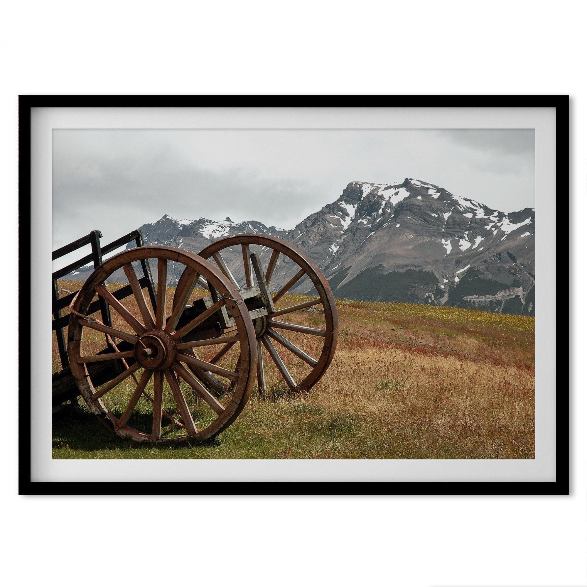 A fine art print of an old plower in the meadows of Patagonia, Argentina, with the backdrop of snow-covered mountains.