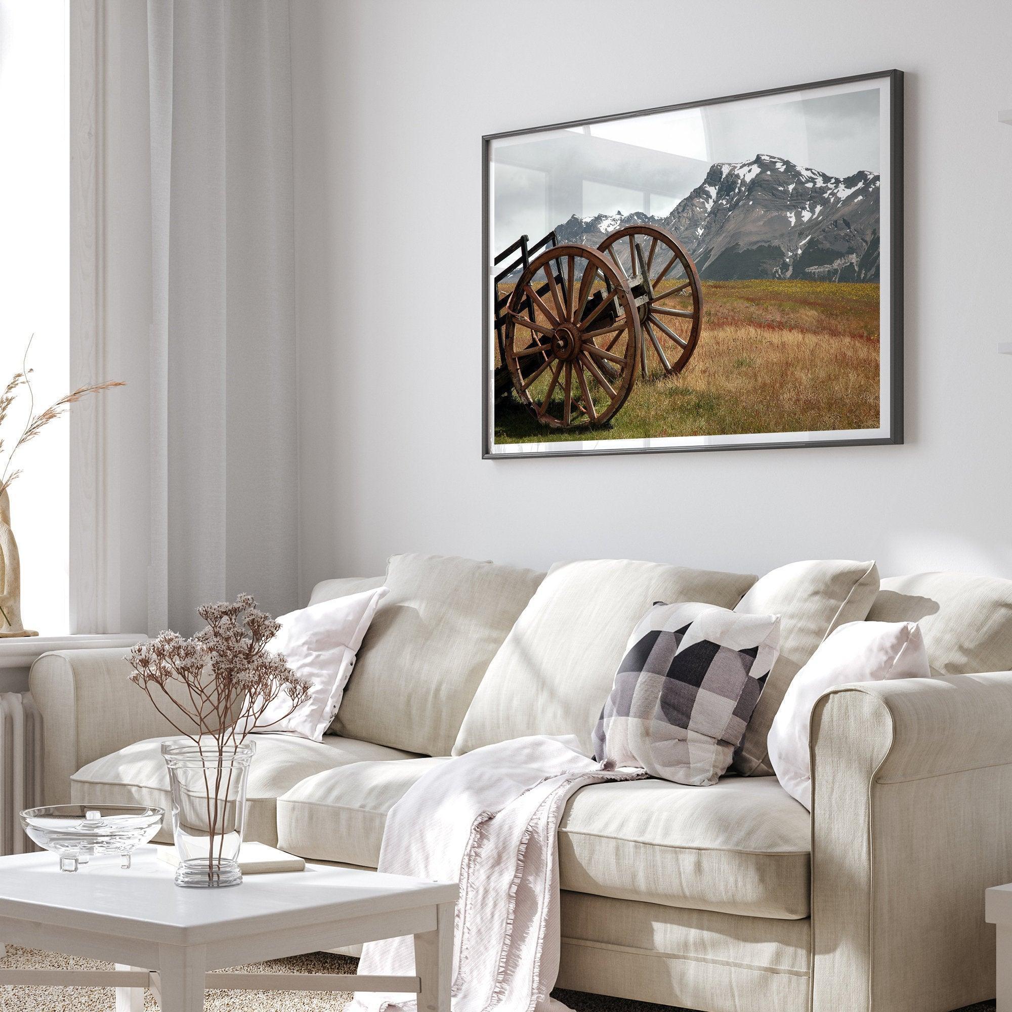 A fine art print of an old plower in the meadows of Patagonia, Argentina, with the backdrop of snow-covered mountains.