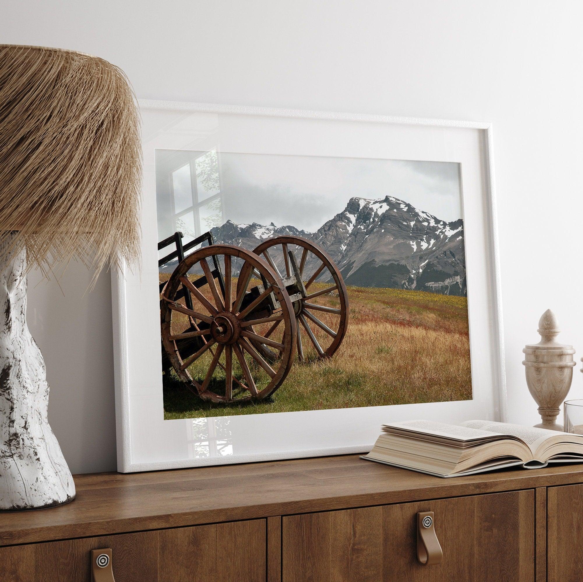 A fine art print of an old plower in the meadows of Patagonia, Argentina, with the backdrop of snow-covered mountains.