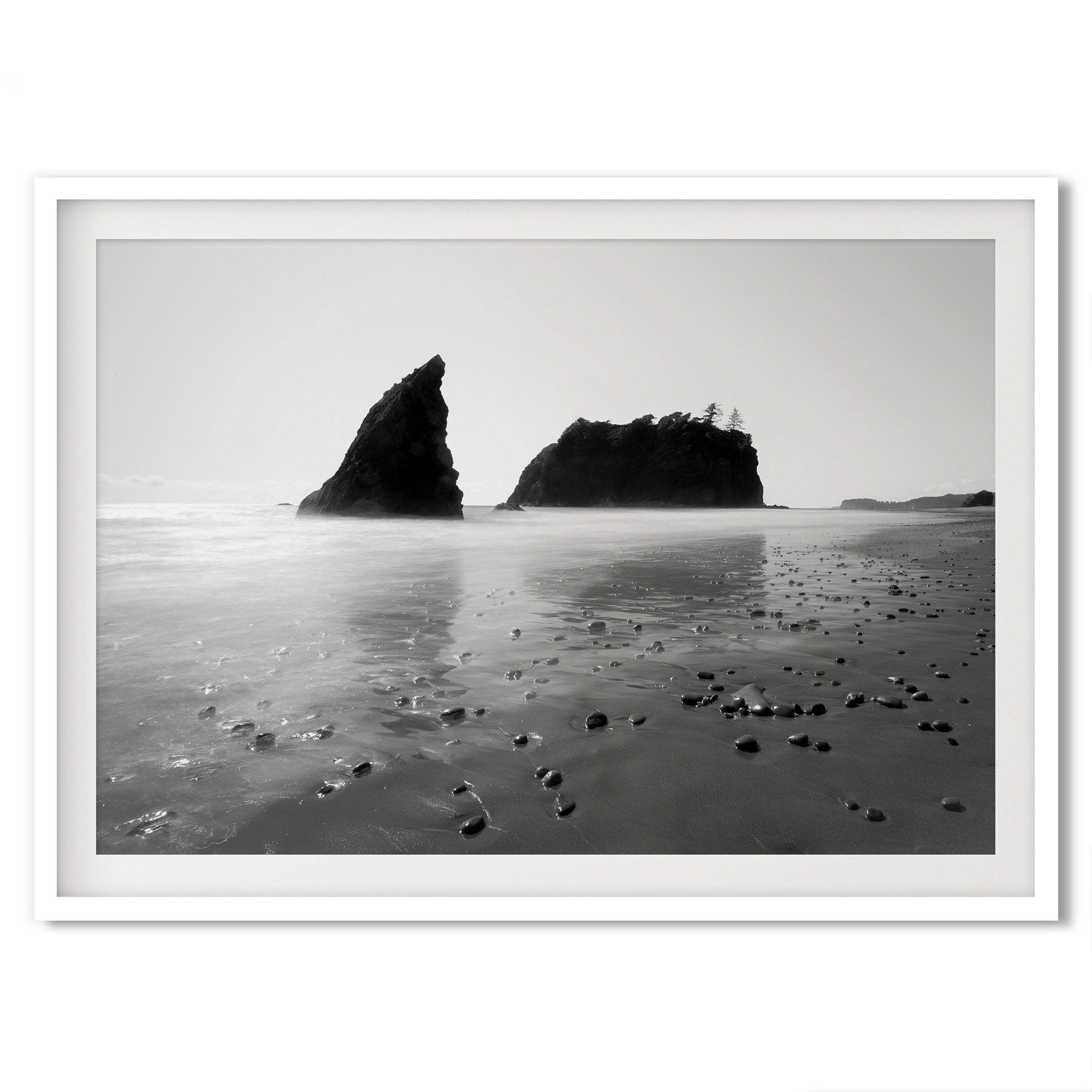 A fine art print of Ruby Beach in Olympic National Park, Washington. This black and white beach wall art features creamy waves in long exposure and dark-shaded towering rocks emerging from the ocean.