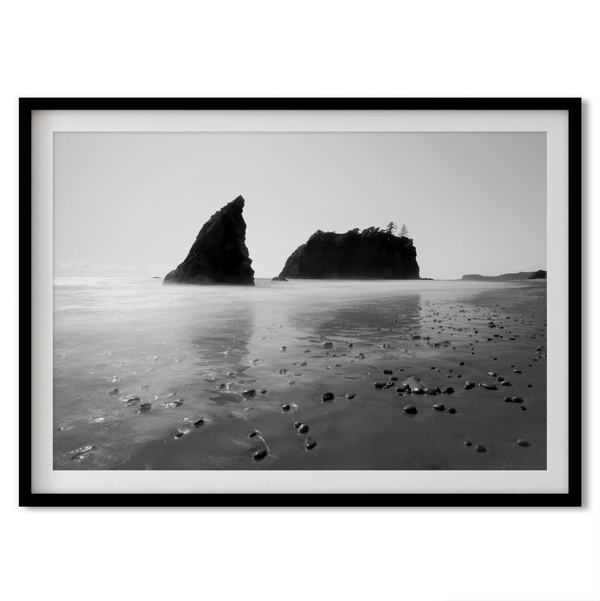 A fine art print of Ruby Beach in Olympic National Park, Washington. This black and white beach wall art features creamy waves in long exposure and dark-shaded towering rocks emerging from the ocean.