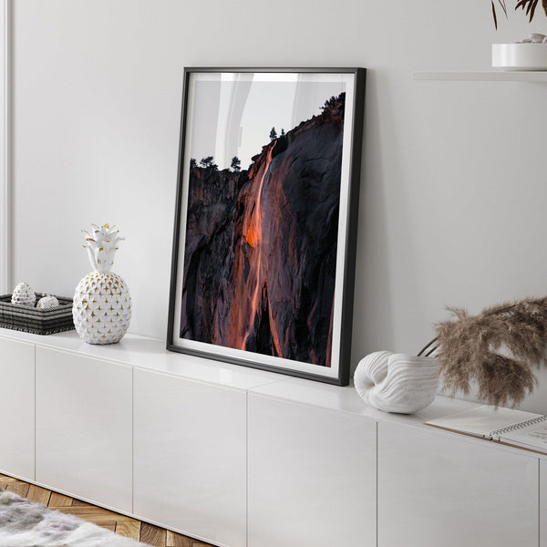 This premium photography framed or unframed fine poster print of Yosemite National Park Firefall - a rare phenomenon where Horsetail Falls in Yosemite seems to be flowing with fire rather than water.