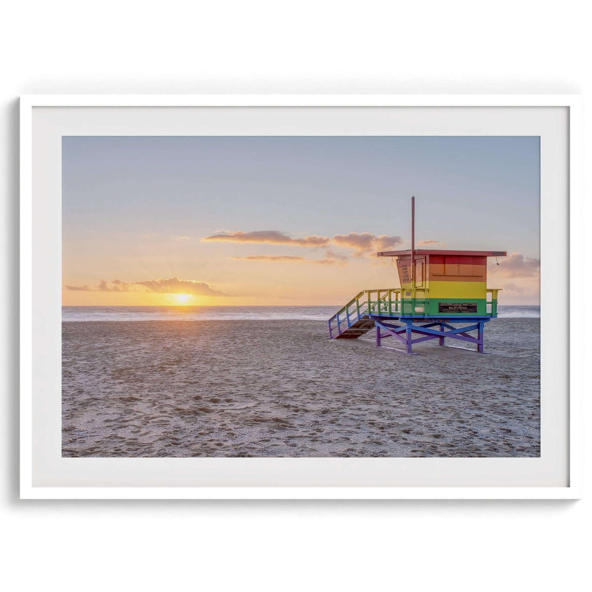 A fine art colorful Los Angeles print featuring Venice Beach at Sunset. This stunning California beach wall art features the famous lifeguard towers of Venice Beach at sunset with the ocean in the backdrop.