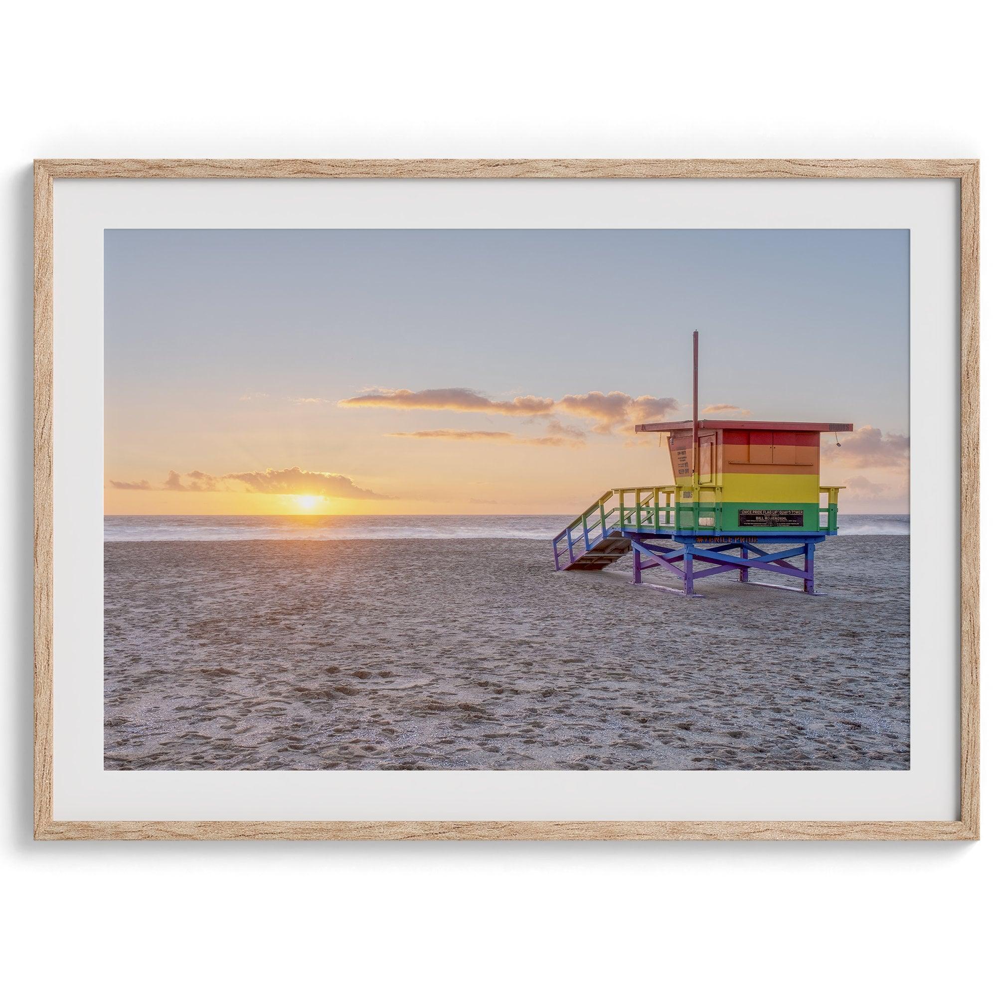 A fine art colorful Los Angeles print featuring Venice Beach at Sunset. This stunning California beach wall art features the famous lifeguard towers of Venice Beach at sunset with the ocean in the backdrop.