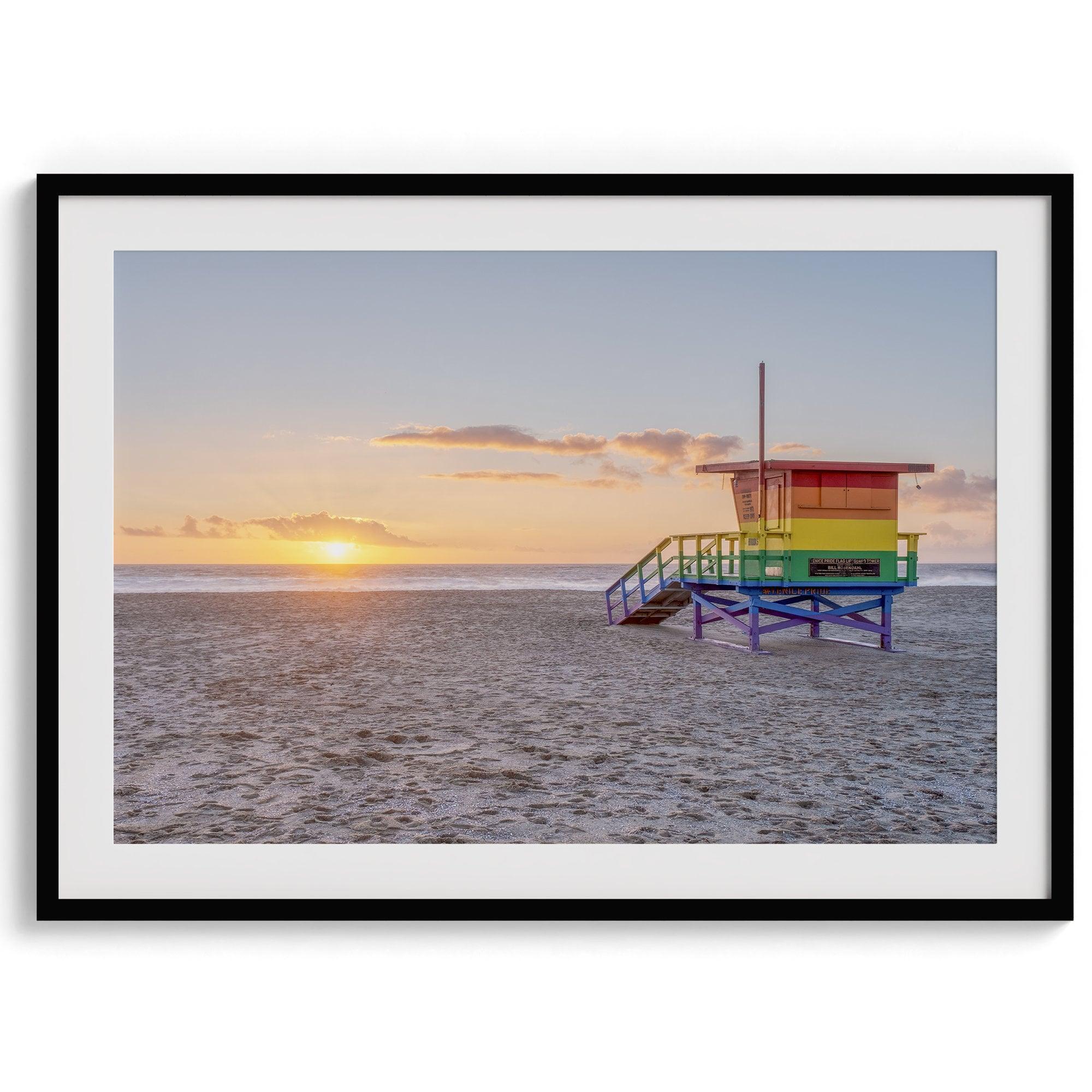 A fine art colorful Los Angeles print featuring Venice Beach at Sunset. This stunning California beach wall art features the famous lifeguard towers of Venice Beach at sunset with the ocean in the backdrop.