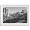 A fine art Yosemite Print featuring Yosemite Valley covered in snow in winter and a beautiful fog lays in the valley forest. This black and white mountain wall art is perfect for nature and fine art lovers.