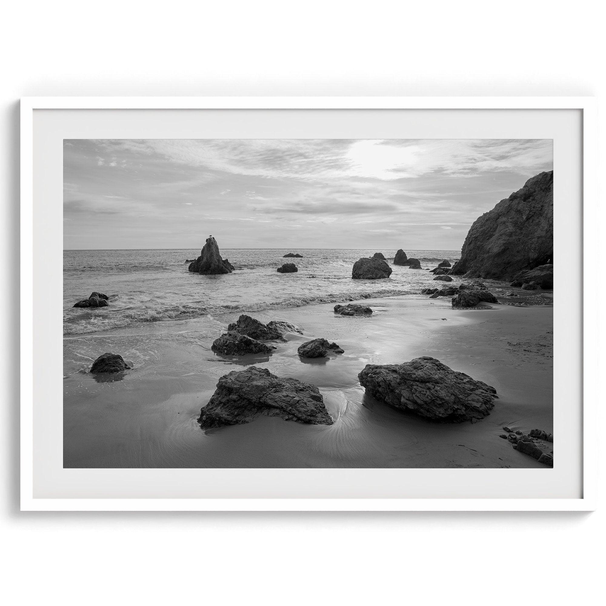 A fine art black and white beach print featuring El Matador State Beach in MalIbu. This southwest coastal decor captures the ragged beauty of the California coast.