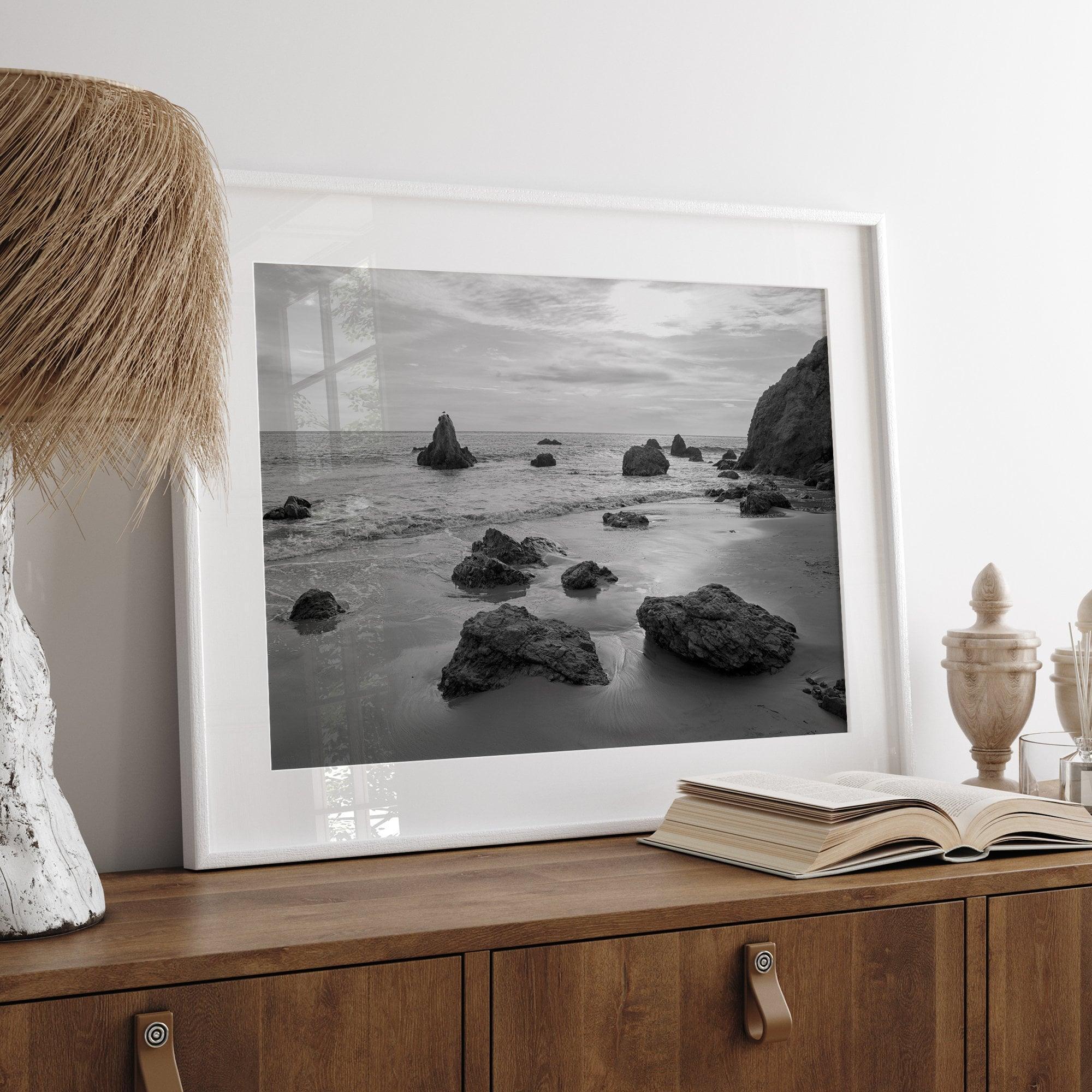 A fine art black and white beach print featuring El Matador State Beach in MalIbu. This southwest coastal decor captures the ragged beauty of the California coast.