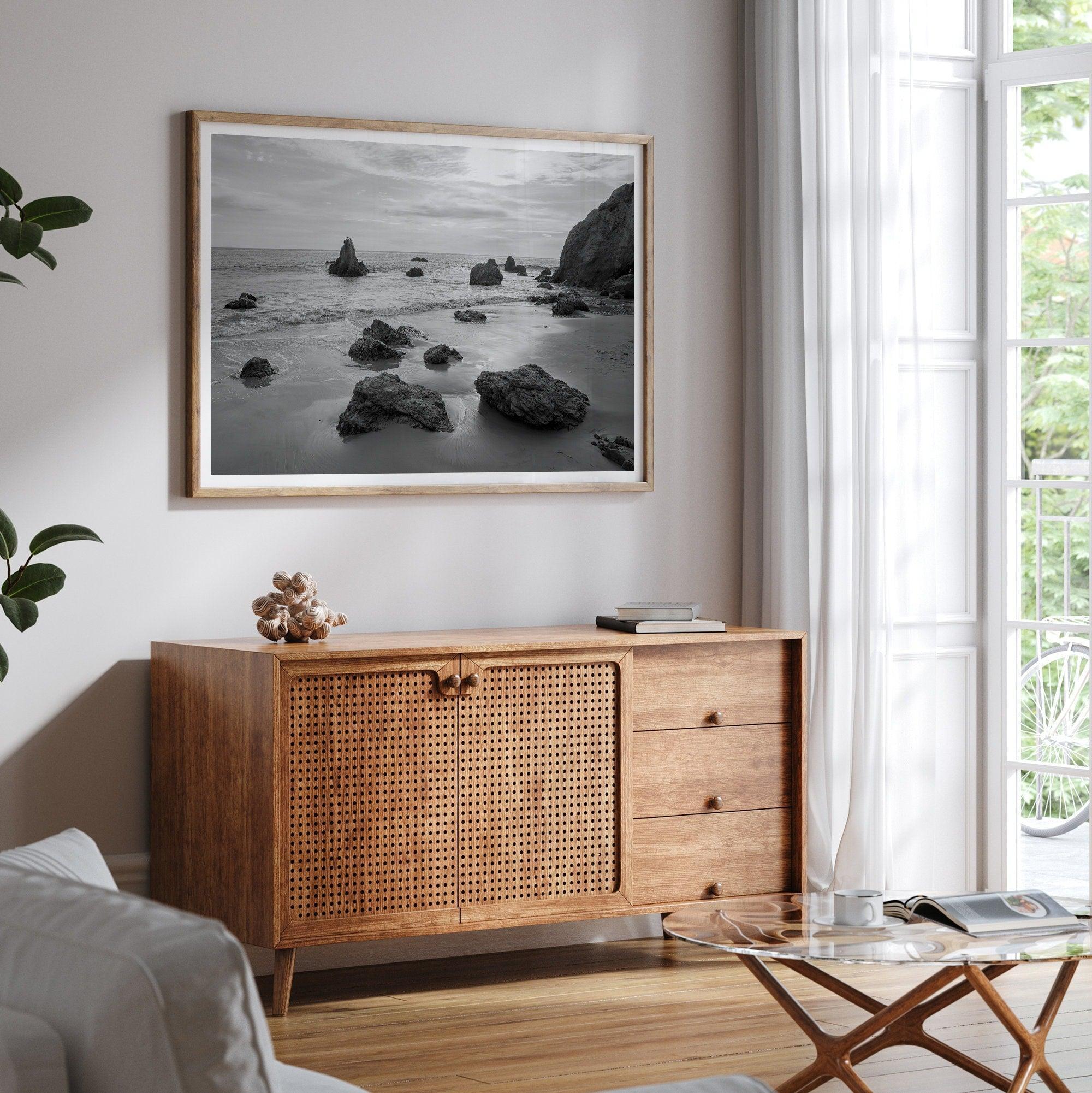 A fine art black and white beach print featuring El Matador State Beach in MalIbu. This southwest coastal decor captures the ragged beauty of the California coast.