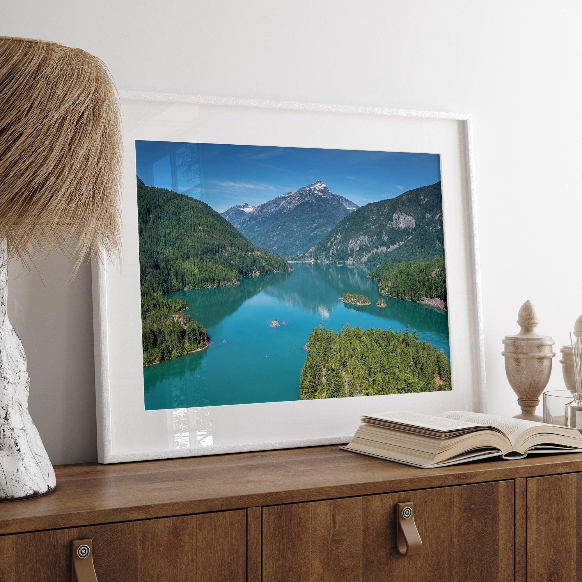 A fine art poster print of Diablo Lake in North Cascades National Park showcasing the deep blue water and the reflection of the surrounding mountains.