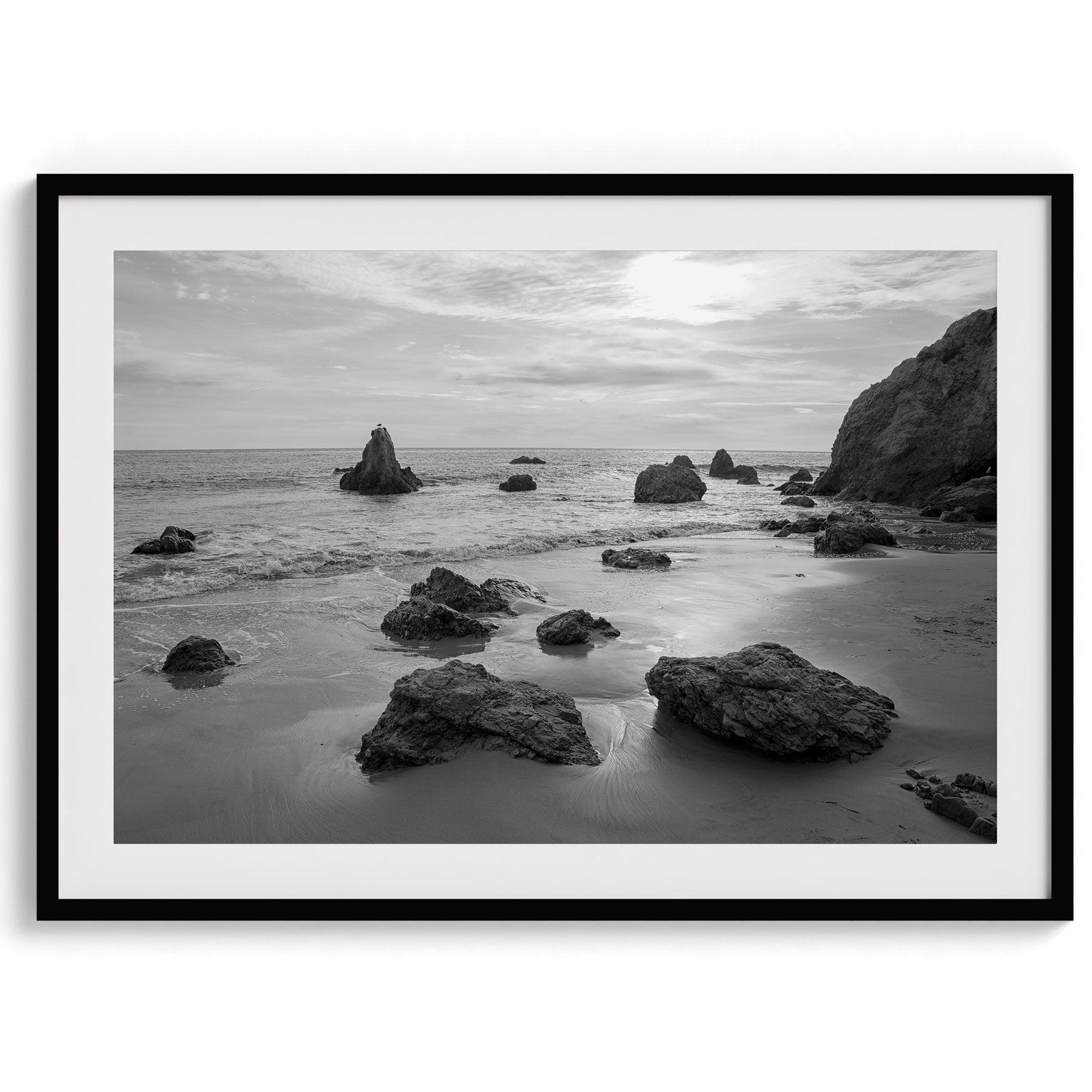 A fine art black and white beach print featuring El Matador State Beach in MalIbu. This southwest coastal decor captures the ragged beauty of the California coast.