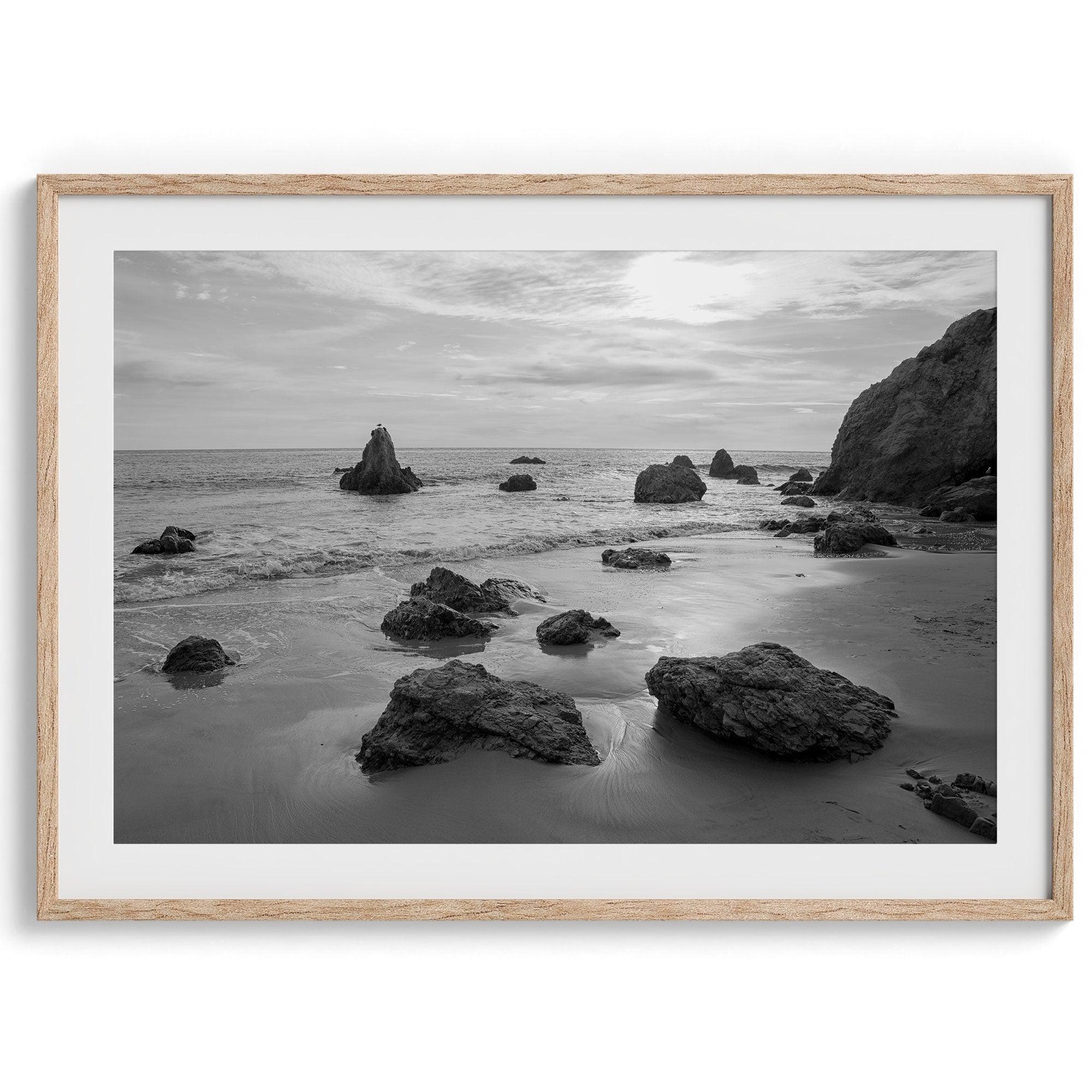 A fine art black and white beach print featuring El Matador State Beach in MalIbu. This southwest coastal decor captures the ragged beauty of the California coast.