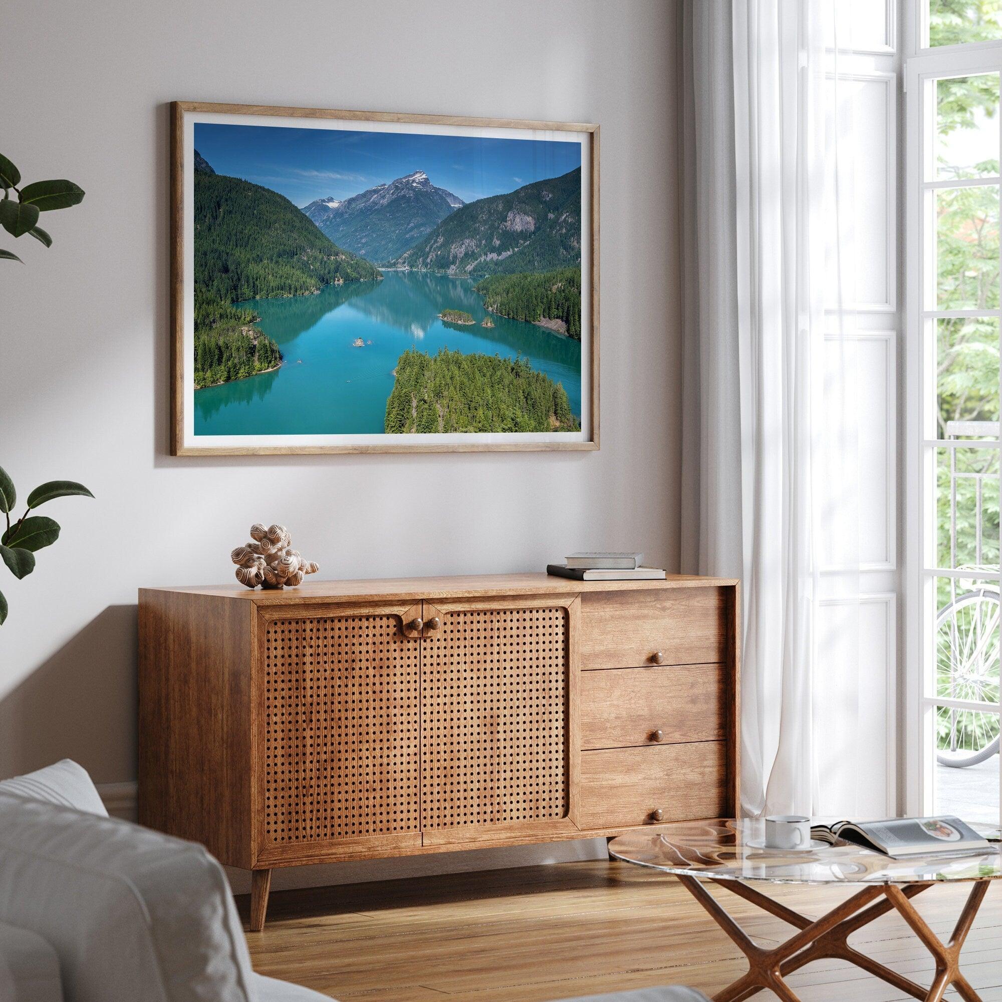 A fine art poster print of Diablo Lake in North Cascades National Park showcasing the deep blue water and the reflection of the surrounding mountains.