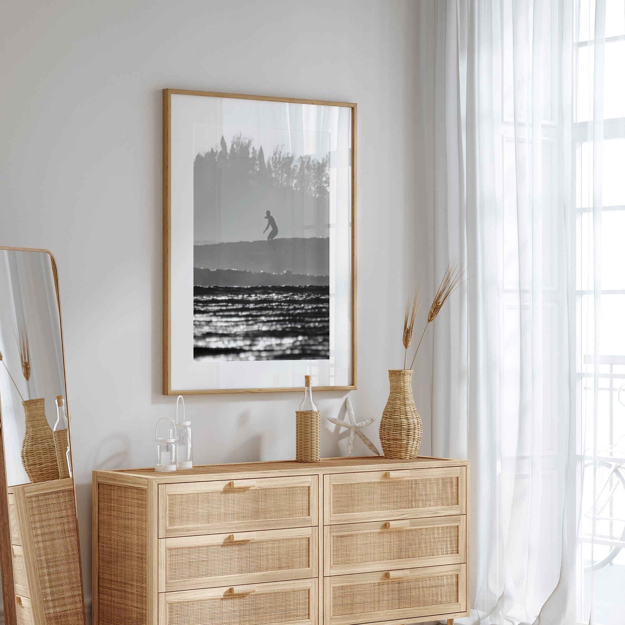 Black and white vertical photo print of a surfer riding a wave in Kauai, Hawaii.