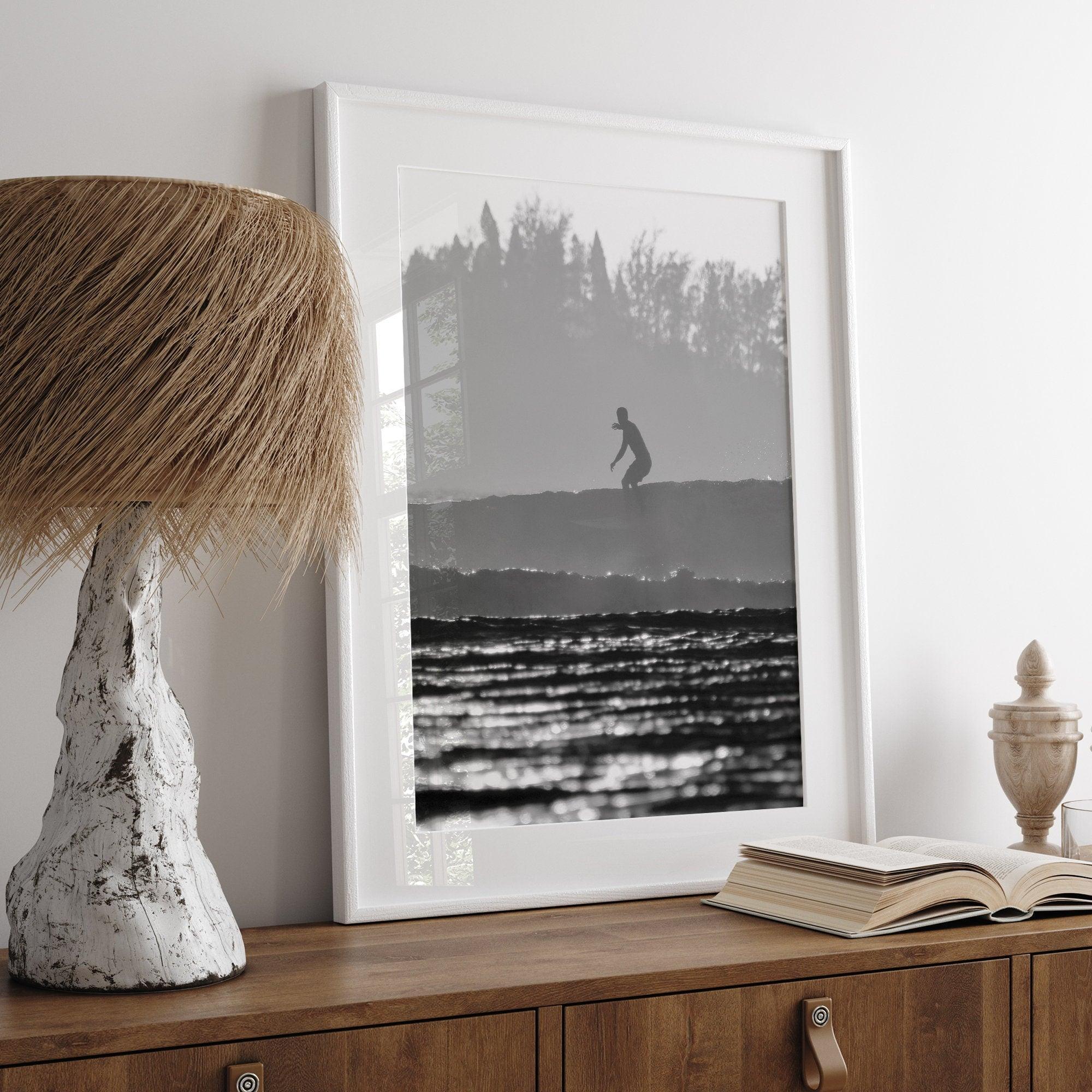 Black and white vertical photo print of a surfer riding a wave in Kauai, Hawaii.