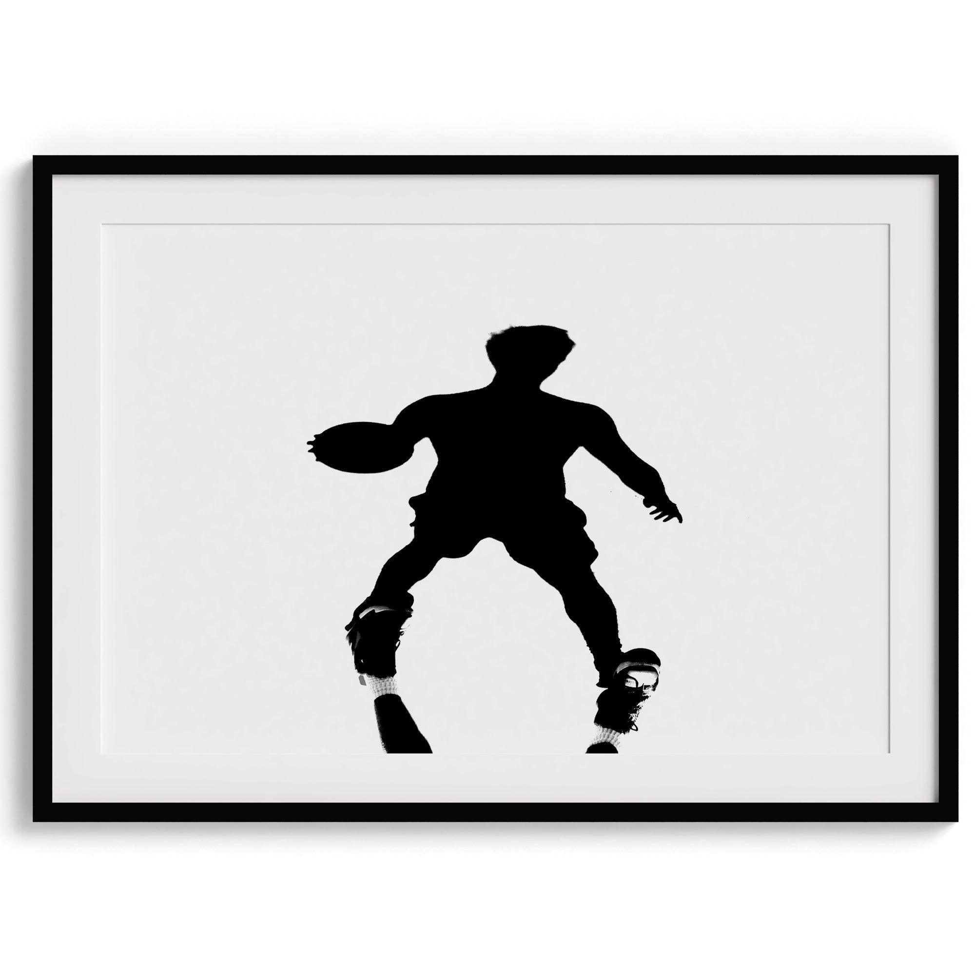 Black and white fine art photography poster print of a basketball player's shadow dribbling a ball on a sunny court.