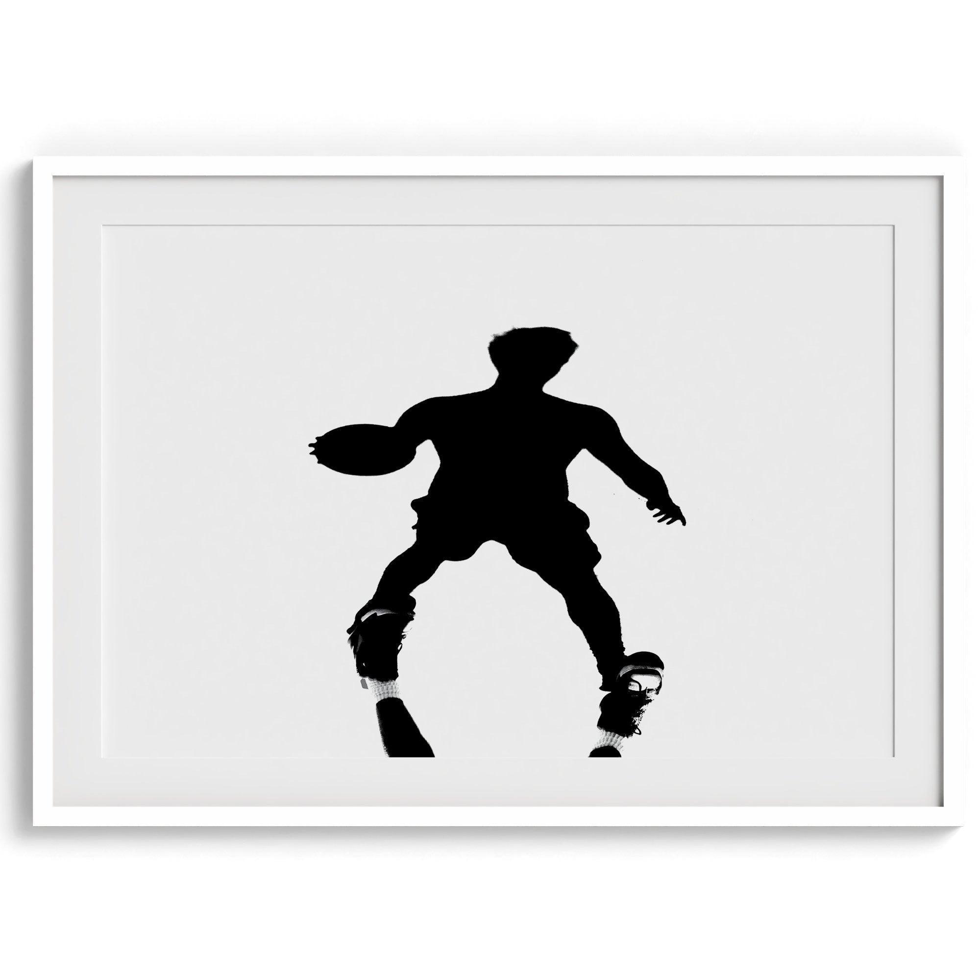 Black and white fine art photography poster print of a basketball player's shadow dribbling a ball on a sunny court.