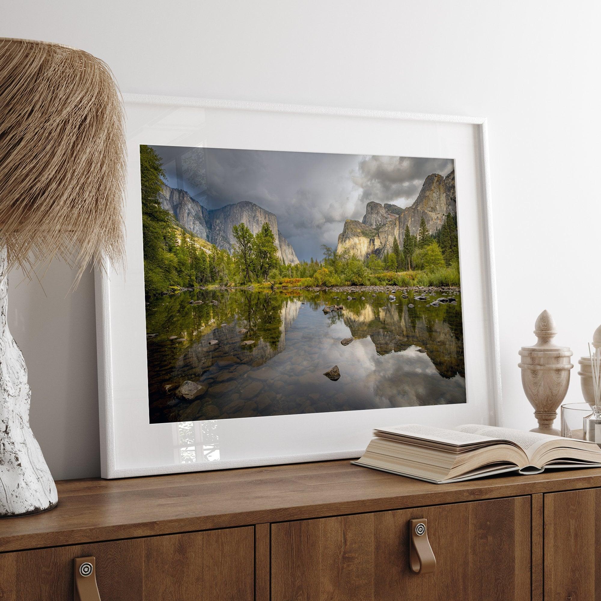 A stunning framed large Yosemite National Park print that shows the breathtaking valley at sunset with its mountains, rivers, forests, and waterfalls. A truly mesmerizing landscape that is as perfect as your wall decor as it is a special gift.