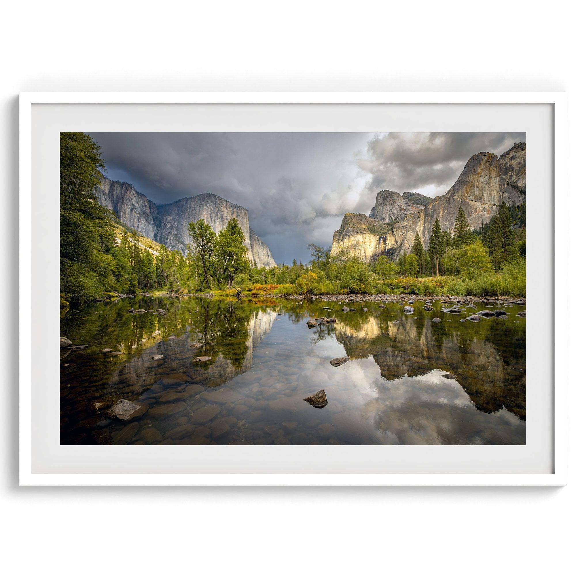 A stunning framed large Yosemite National Park print that shows the breathtaking valley at sunset with its mountains, rivers, forests, and waterfalls. A truly mesmerizing landscape that is as perfect as your wall decor as it is a special gift.