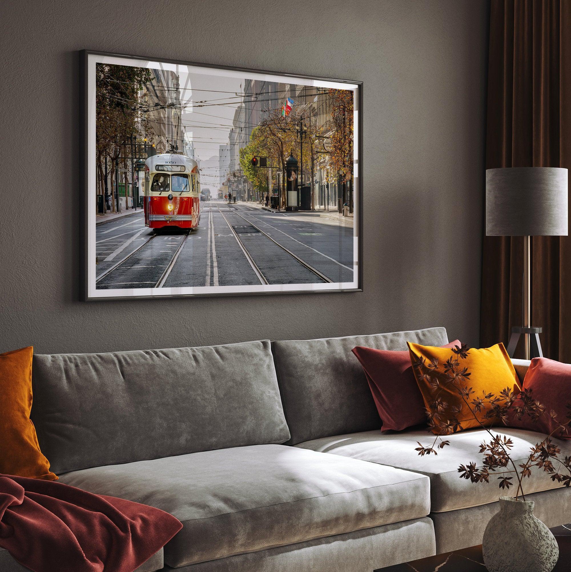 Fine art photograph of a cable car on Market Street in San Francisco, during golden hour. The image shows SF architecture, people, and the interplay of light and shadow.